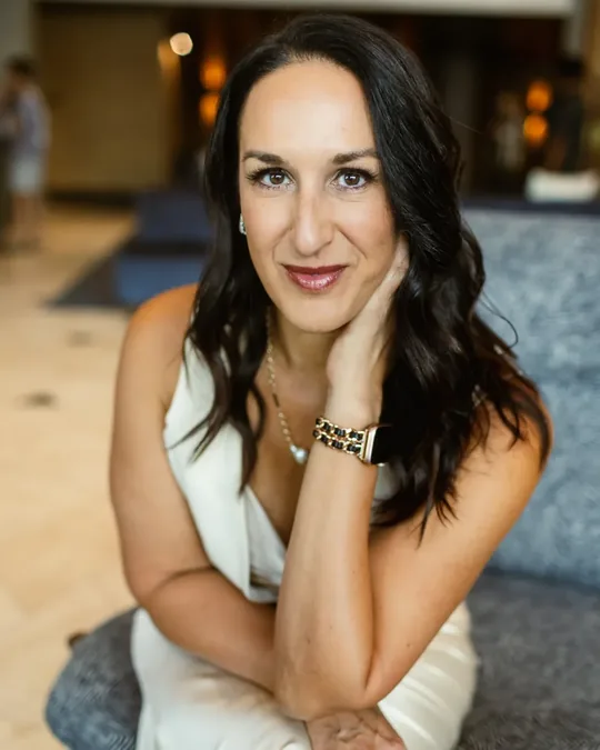 Kristin Darga, executive coach, seated in a hotel lobby